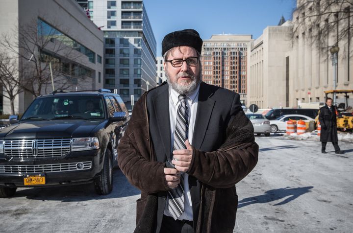 Rabbi Barry Freundel leaves the District Superior courthouse after his hearing was postponed until the afternoon, February 19, 2015 in Washington, DC.