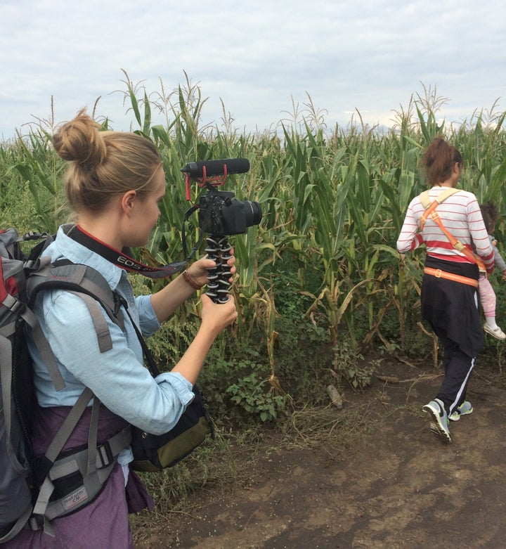 Sophia Jones filming on the Serbia-Hungary border, a few hours before the group of Syrian refugees from Kobani she traveled w