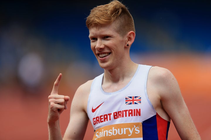 Bosworth celebrates winning the men's 5000m race walk with a new British record at the Sainsbury's British Championships
