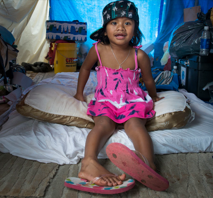 Emichan in her family's tent in Honolulu.