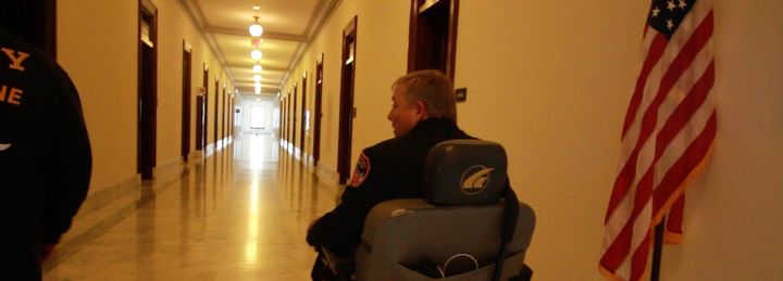 Ray Pfeifer rolls through the halls of the Russell Senate Office Building.