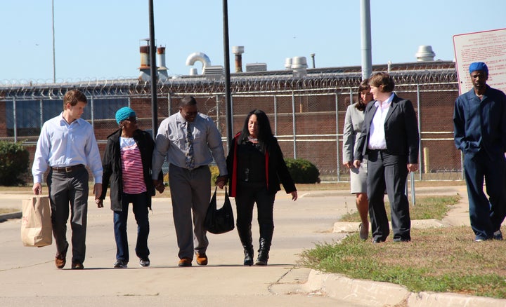 Shawn Whirl, center, is flanked by family, friends and attorneys, exists the Hill Correctional Center in Galesburg, Illinois