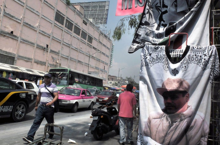 Mexican drug lord Joaquín “El Chapo” Guzmán, pictured here on a T-shirt in Mexico City, is still at