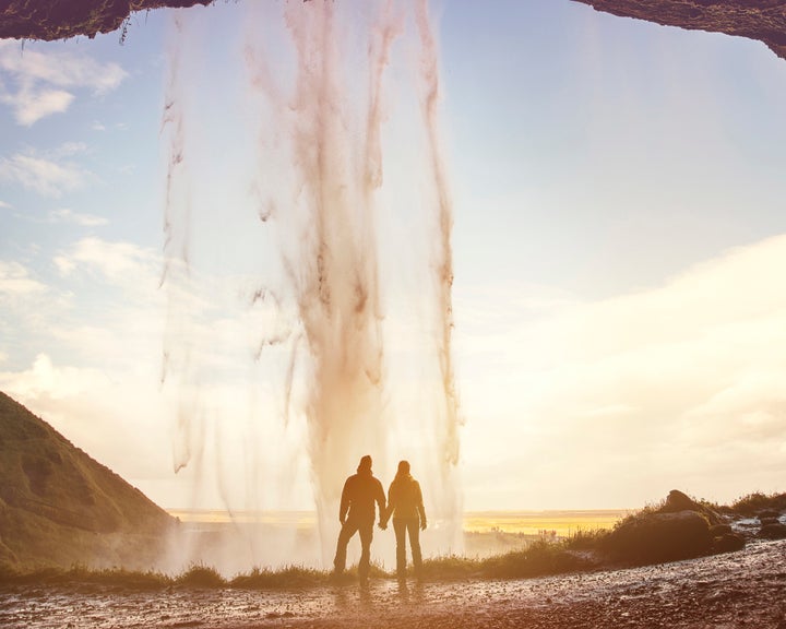 The pair at Seljalandsfoss waterfall in Iceland. 