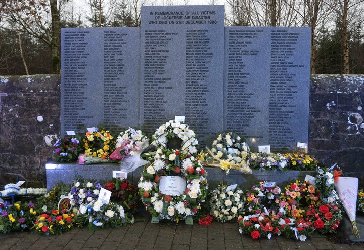 The Lockerbie air disaster memorial wall in Lockerbie, Scotland, is covered in wreaths following a memorial service to commem
