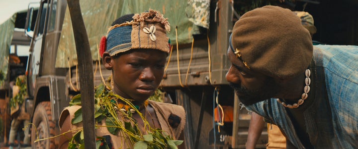 Abraham Attah and Idris Elba star in a scene from "Beasts of No Nation."