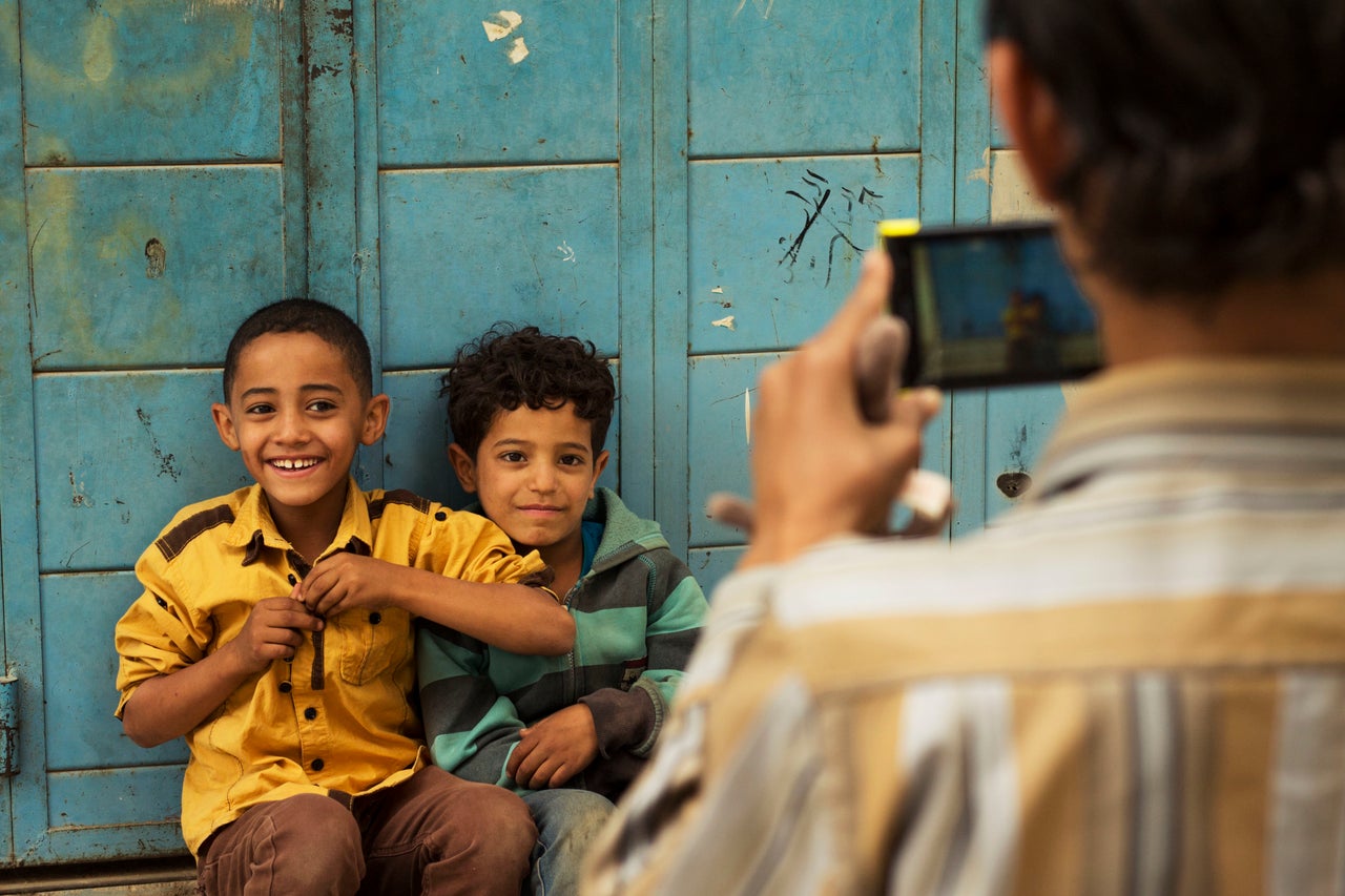 A group of children photographed while exploring the empty streets.