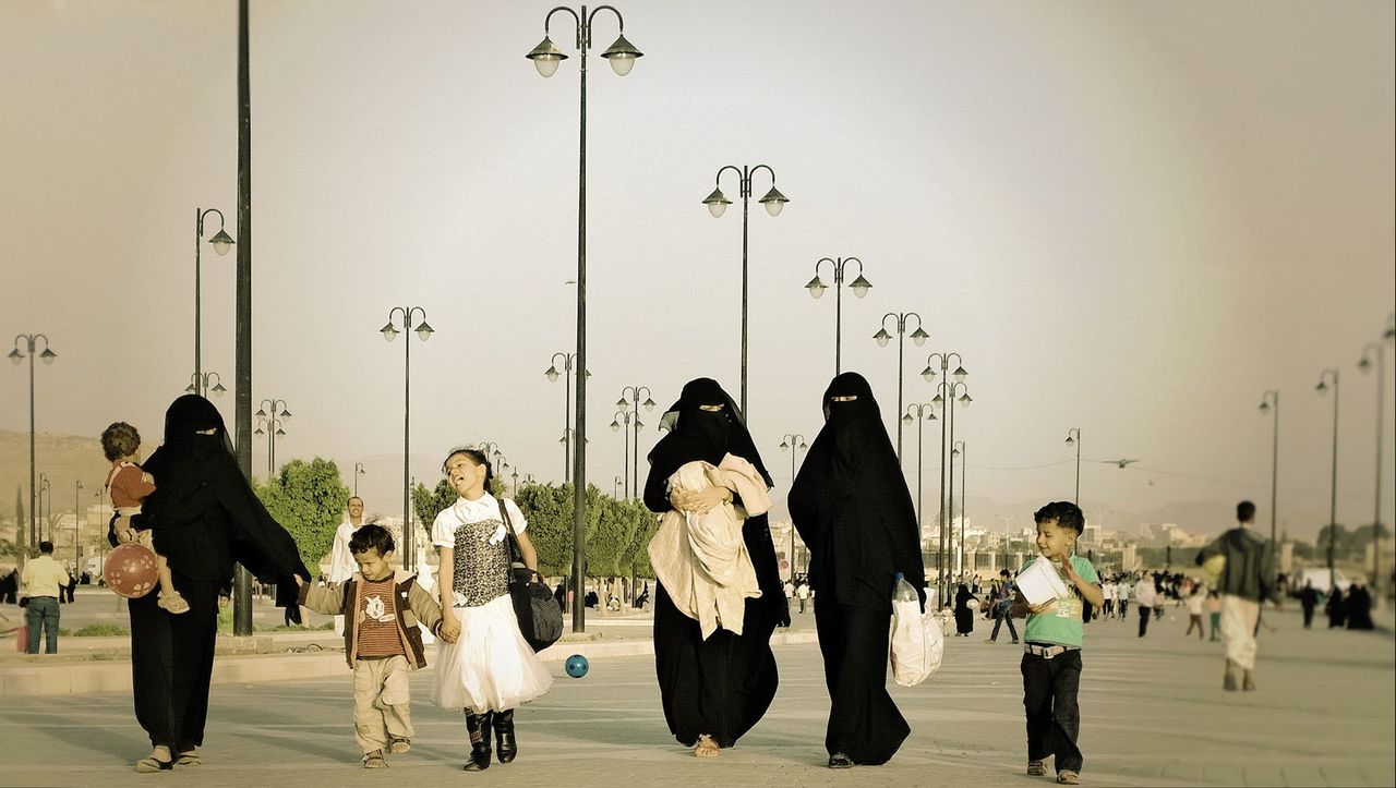 A family walks near the Saleh Mosque on Oct. 24, 2014.