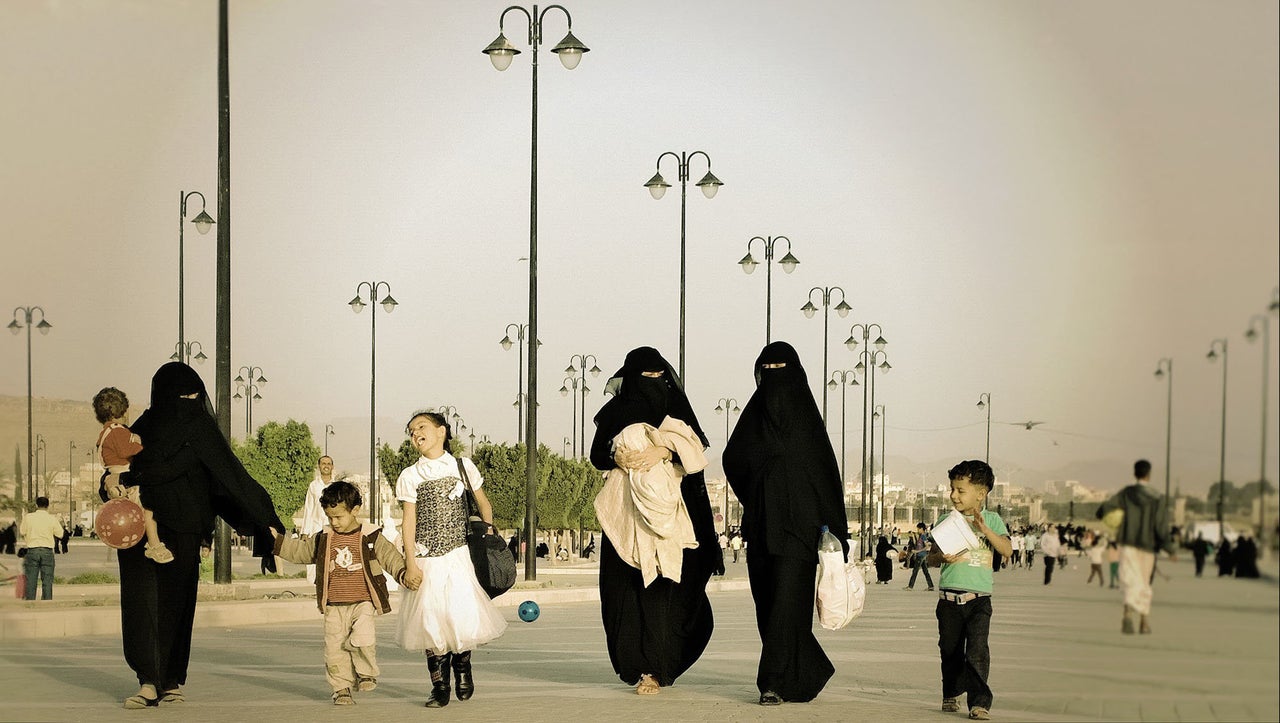 A family walks near the Saleh Mosque on Oct. 24, 2014.