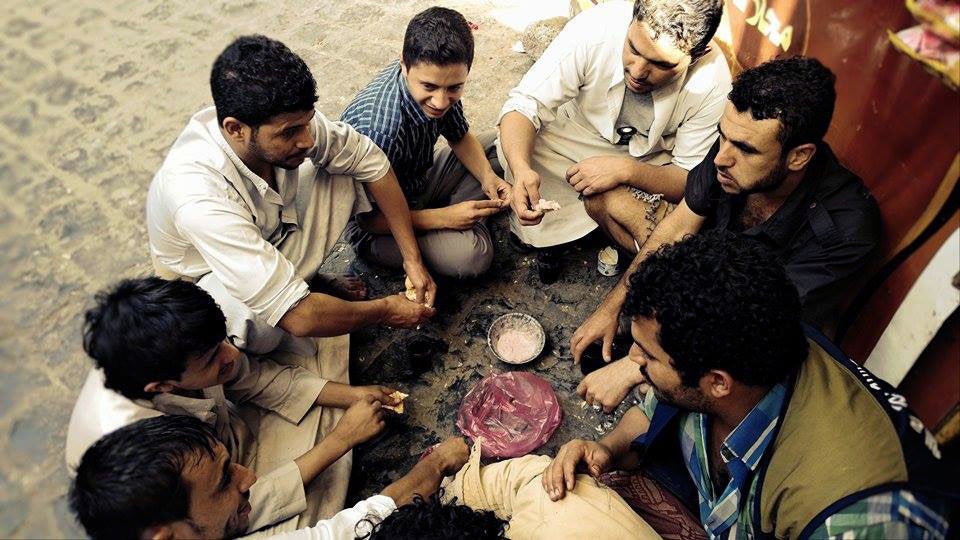 Neighbors and friends gather for breakfast during an airstrike, April 2, 2015.