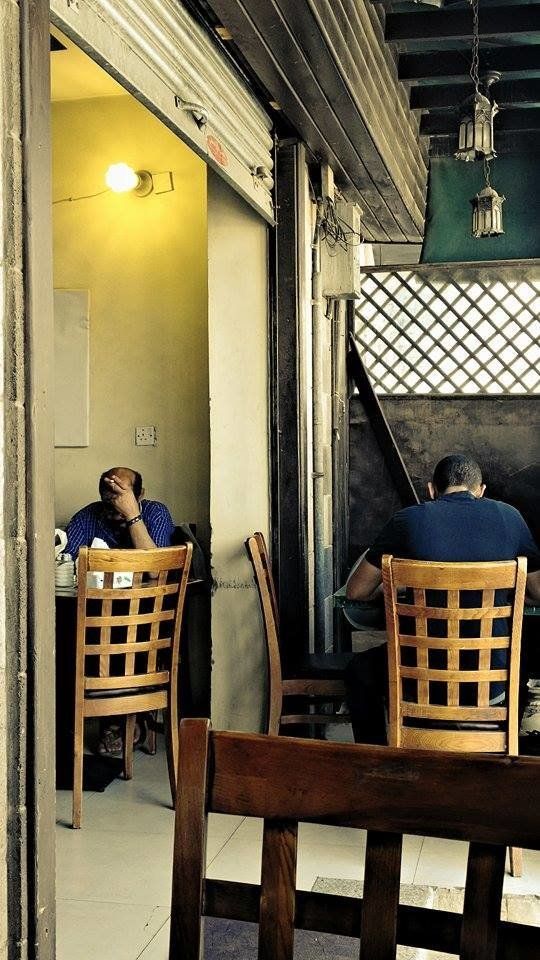 After a difficult night of heavy bombing, a breakfast bistro in Sanaa is filled with diners on April 13, 2015.