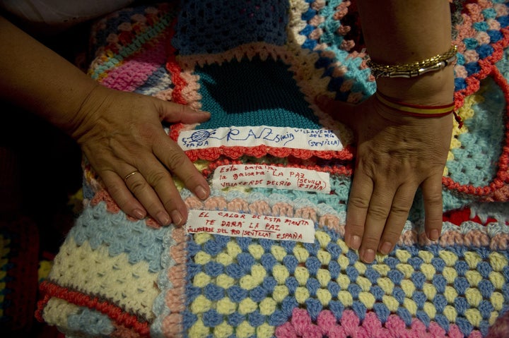 "The warmth from this blanket will give you peace," reads the label on one of the blankets.