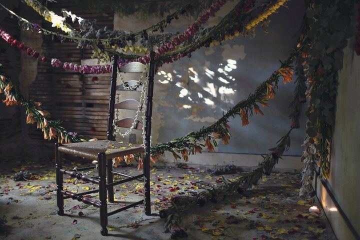 A scene from Flower House, a floral installation in an abandoned house in Detroit.