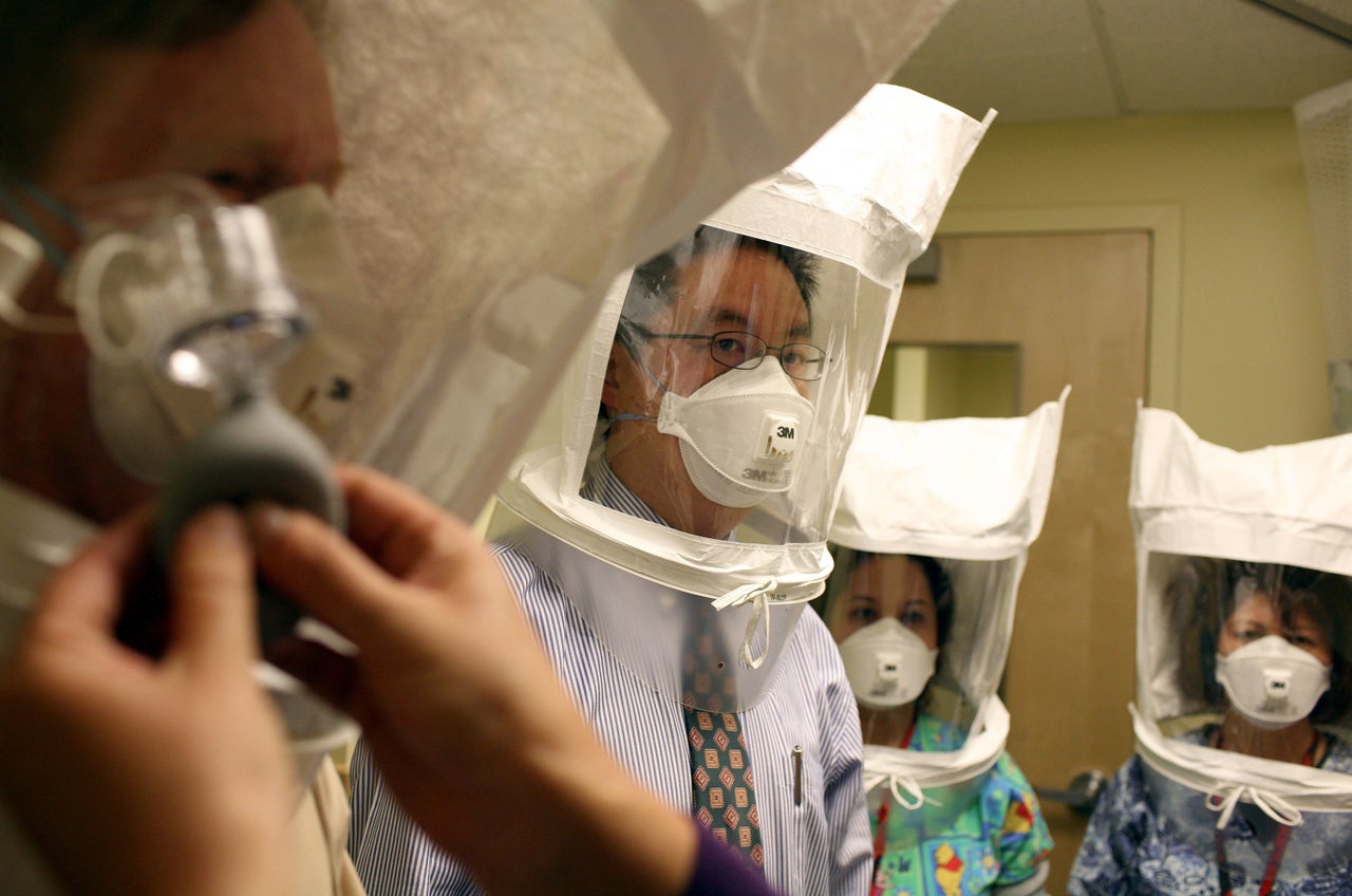 Doctors and nurses in Oakland, California, test respiratory hoods used when they suspect a patient has tuberculosis or the swine flu.