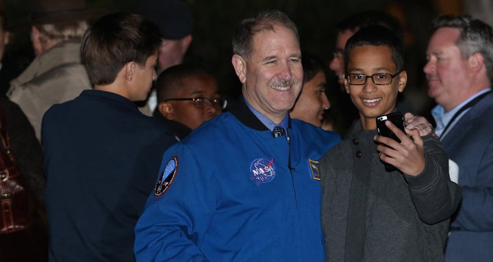 Ahmed Mohamed poses with former astronaut and NASA Associate Administrator for the Science Mission Directorate John Grunsfeld.