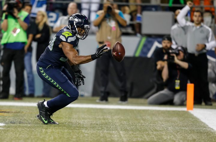 Seattle's Wright bats a loose ball out of the back of the end zone during the second half of his team's contest against Detroit. The Seahawks won the game, 13-10.