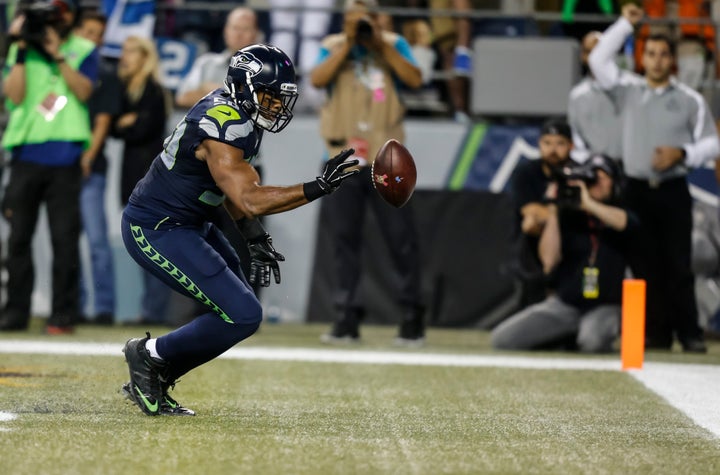 Seattle's Wright bats a loose ball out of the back of the end zone during the second half of his team's contest against Detro
