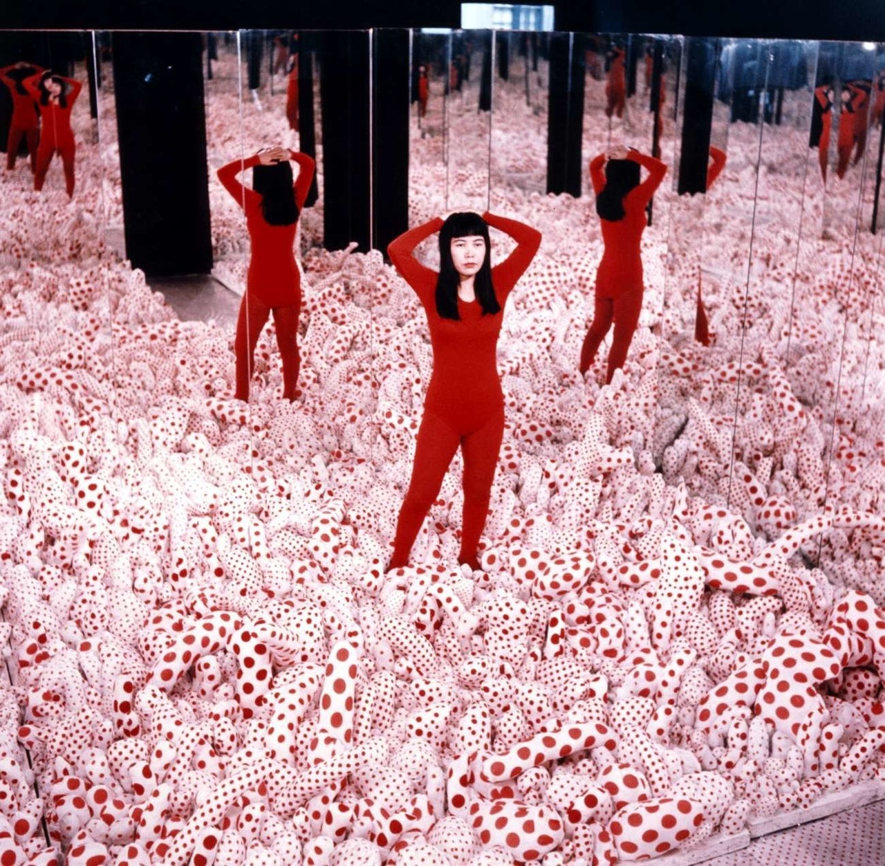 People use their smartphones to take pictures of the Yayoi Kusama