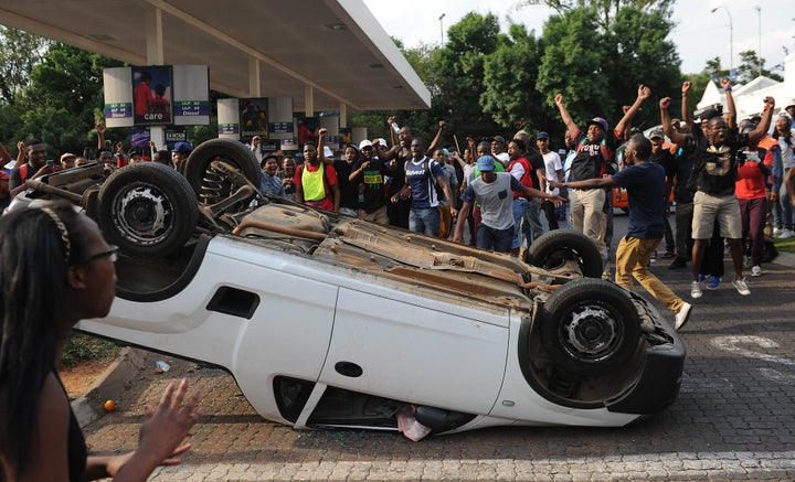 During the week of protests, students burned tires outside parliament in Cape Town and shouted at police on stand-by