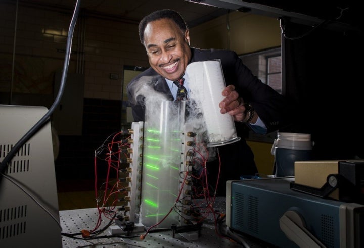 Ronald L. Mallett with a demonstration model time machine (not the real thing!) he built based on his research of a circulating laser light device that might ultimately twist space and time and lead to the possibility of time travel to the past and the future.