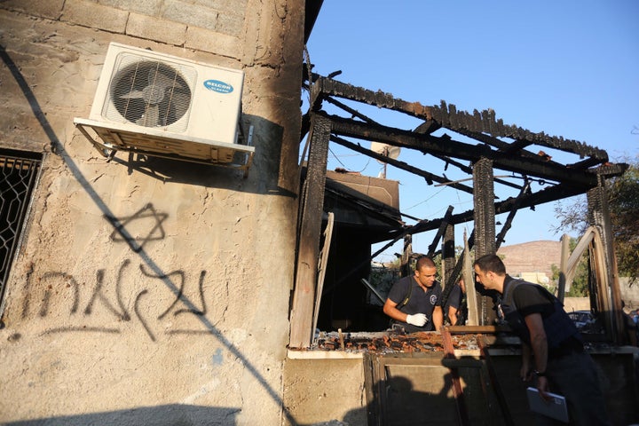 Israeli crime scene investigation after the Duma arson attack that killed a Palestinian baby and his parents.  