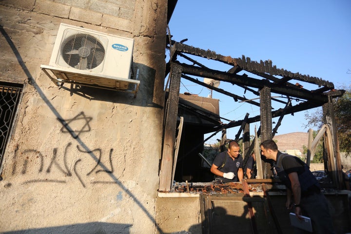 Israeli crime scene investigation after the Duma arson attack that killed a Palestinian baby and his parents. 