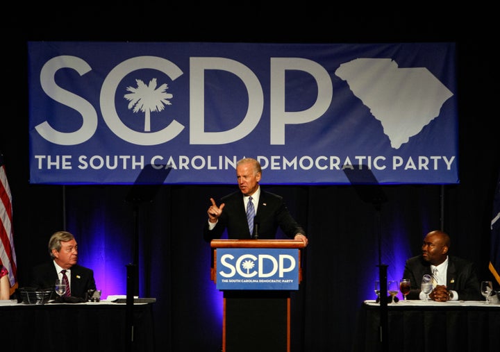 Joe Biden addresses the South Carolina Democratic Party as former Democratic Chairman, Dick Harpootlian, left, looks on.