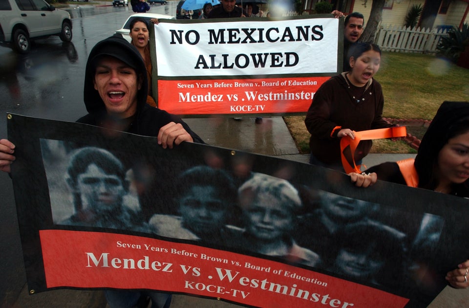 In 2004, student Hector Flores (left) marched through the rain near Hoover Elementary in California....