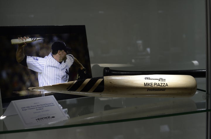 New York Mets batter Mike Piazza, left, confronts New York Yankees pitcher  Roger Clemens after he threw a bat during World Series Game 1 at Yankees  Stadium in New York on October