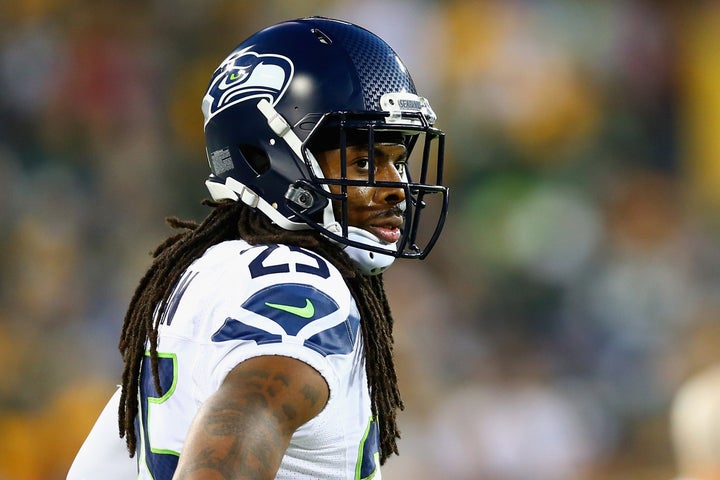 Richard Sherman looks on during the Seattle Seahawks' game against the Green Bay Packers at Lambeau Field on Sept. 