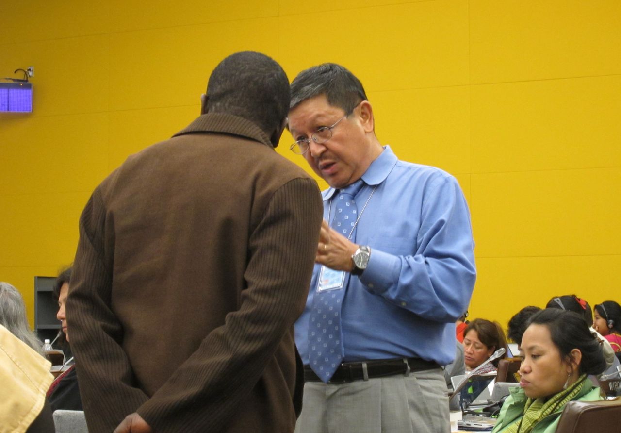 Navin Rai (right), the World Bank's top advisor on indigeneous peoples affairs from 2000 to 2012, talks with a member of the United Nations Permanent Forum on Indigenous Issues during a conference.