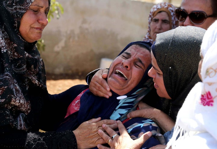 Relatives mourn during the Aug. 8, 2015, funeral of Saad Dawabsheh, the father of a Palestinian toddler burned to death in an arson attack by Jewish extremists in the West Bank, in the Duma village of the city of Nablus.