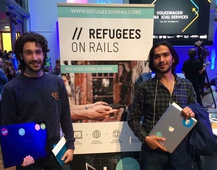 The nonprofit has been talking to refugees around Berlin to understand how to make their lessons as accessible and useful as possible. Here, two Syrian refugees help Refugees on Rails collect laptop donations at the Lange Nacht der Startups (Long Night of Startups) event in Berlin, Germany, on Sept. 5, 2015.