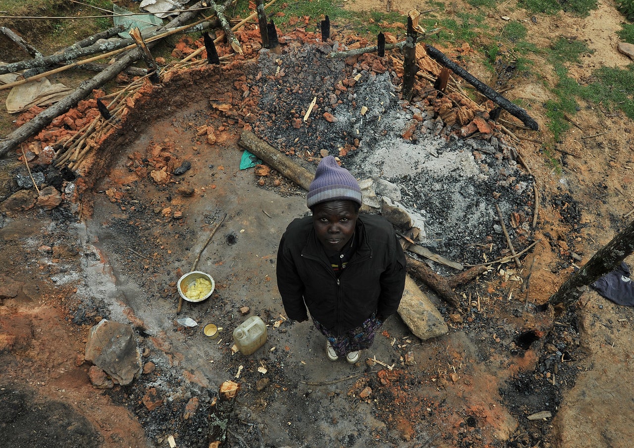 Selly Rotich stands in what used to be her kitchen. She says it was destroyed hours earlier by KFS officers. 