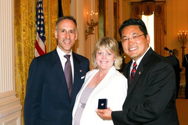 Jack Hawkins, Director of USAID with Julie Hiramine and Kay Hiramine of Colorado Springs, Colo., recipient of the President's