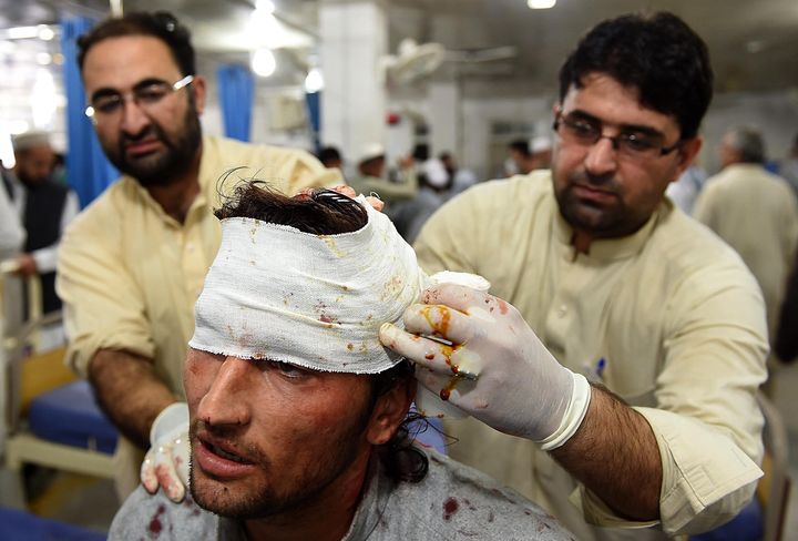 Paramedics treat a man a hospital in Peshawar, Pakistan. 