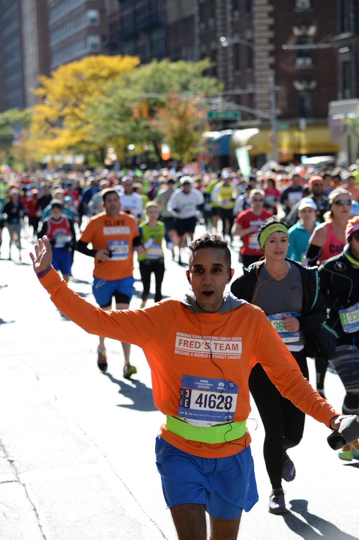 Narang celebrates in the middle of the 2014 marathon.