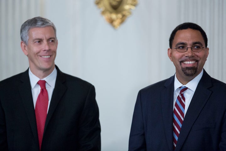 John King Jr., senior advisor at the U.S. Department of Education, right, and Arne Duncan, outgoing U.S. education secretary, smile during a news conference with U.S. President Barack Obama in the State Dining Room of the White House in Washington, on Oct. 2.