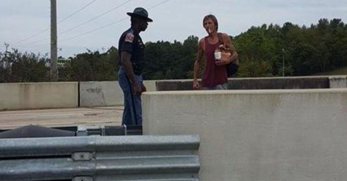 Viral Photo Catches Alabama Cop Helping Homeless Father And Son