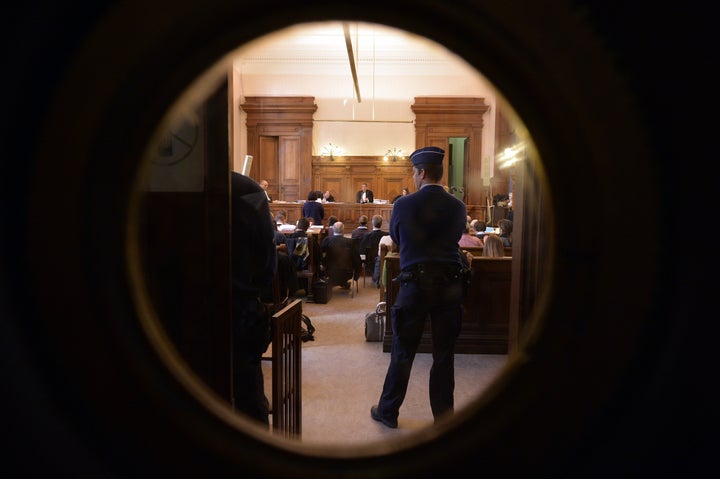 A picture taken on Oct. 26, 2015, shows people attending the first session of the trial.