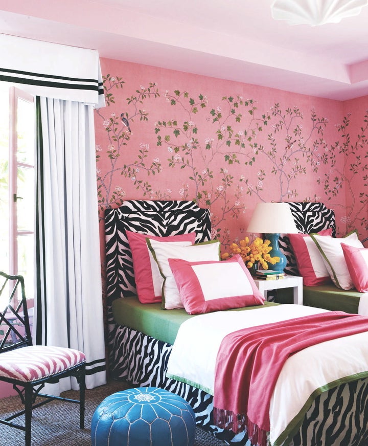 In using the pink chinoiserie wallpaper, Gibson said he started with the paper and then added bold zebra fabric headboards. "I thought, these two things go together. Be bold -- why not!"