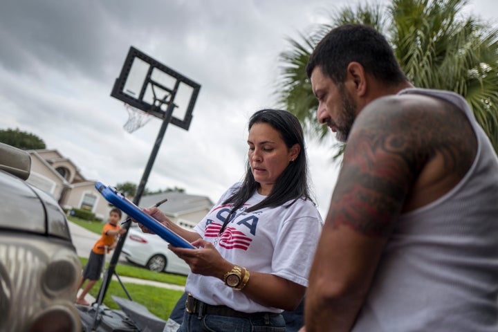 Soraya Marquez, of Mi Familia Vota, conducts voter registration outreach in July in a Puerto Rican neighborhood in Florida. Top Hispanic groups are warning Republican candidates to stop offending the Hispanic community if they want its support in the 2016 election.