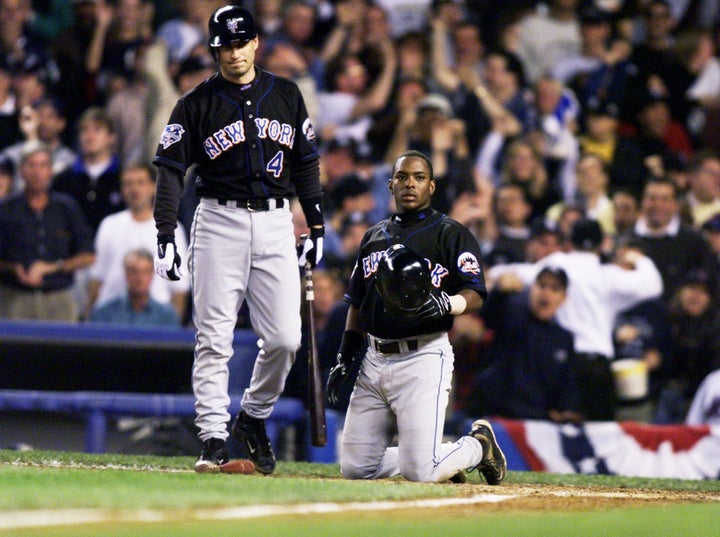 Timo Perez (right) after getting thrown out at the plate in Game 1.