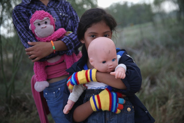 Salvadorian immigrant Stefany Marjorie, 8, holds her doll Rodrigo after crossing the Rio Grande from Mexico into the United States with her family on July 24, 2014, near Mission, Texas. The government created a program meant to deter families from coming to the U.S. without authorization.