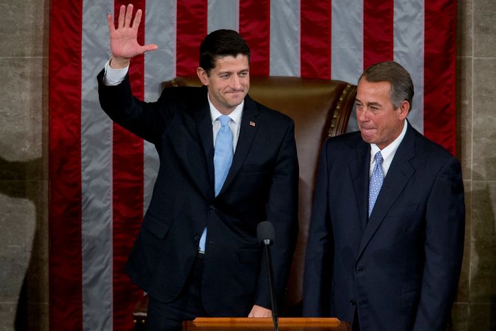 U.S. House Speaker-elect Paul Ryan waves next to House Speaker John Boehner Thursday, after Ryan won the vote to take over the position.