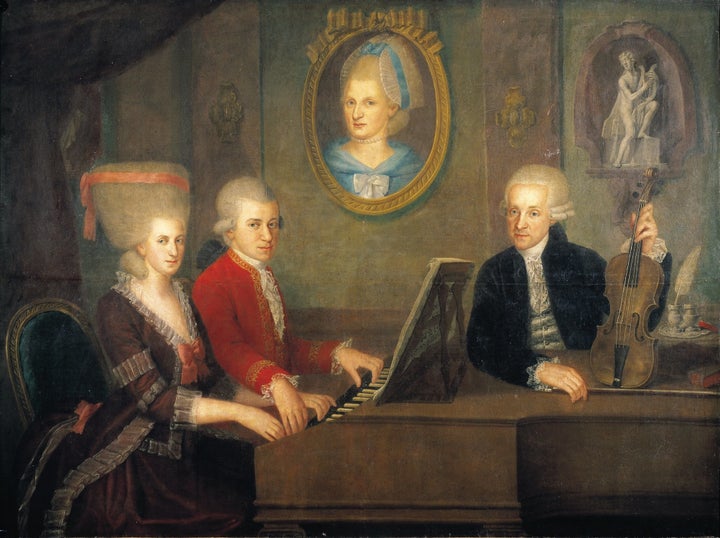 Leopold Mozart with his children Wolfgang and Nannerl at the piano, the portrait of their deceased mother on the wall. Oil on Canvas by Johann Nepomuk Della Croce, around 1780.