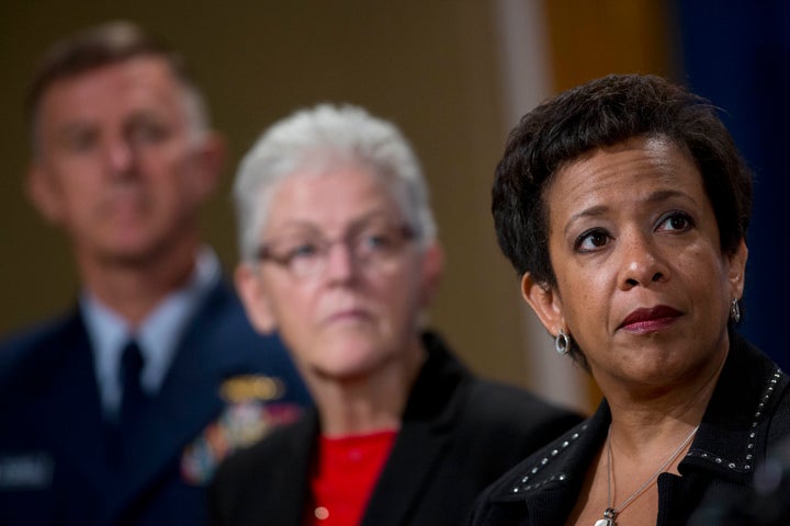 U.S. Attorney General Loretta Lynch, right, under pressure to investigate ExxonMobil for climate fraud.