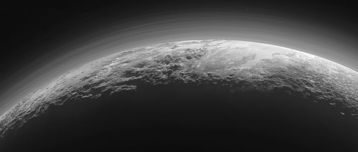 The New Horizons spacecraft also captured this near-sunset view of the rugged, icy mountains and flat ice plains extending to Pluto's horizon after making its closest approach on July 14, 2015.