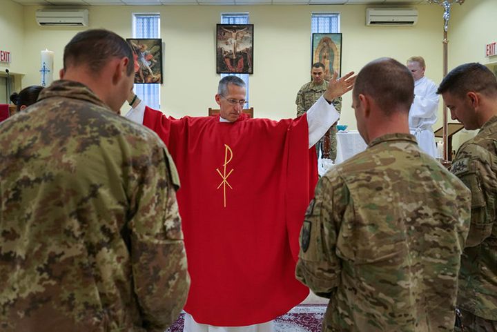 U.S. Army Chaplain Paul Hurley, a Catholic priest, says Mass for the troops at a military base in Kabul, Afghanistan.