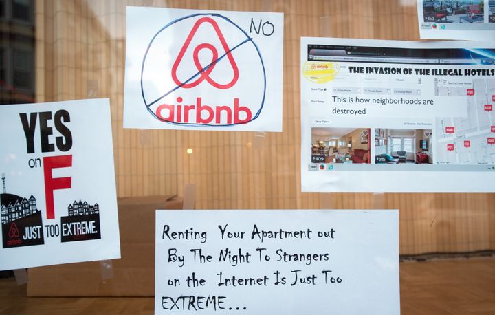 Signs in a San Francisco shop window express support for Proposition F and opposition to short-term rental services such as Airbnb.